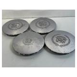 4 Cadillac wheel caps.