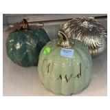 3 tabletop decor pumpkins.
