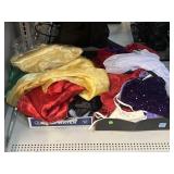 Assorted costumes and fabrics.