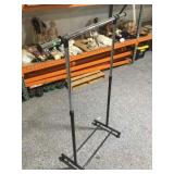 Rolling clothing rack.