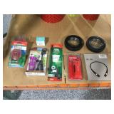 Novelty ashtrays, wireless headset, tank parts.