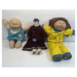 2 CPK dolls. Porcelain doll with fabric body.