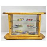 Miniature die cast Funny cars in wooden showcase,