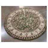 Green round area rug w/pattern, 94in diameter