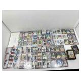 Mixed lot of sports cards in pages