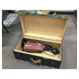 Vintage footlocker trunk and Oreck XL portable