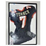 Framed autographed football jersey