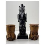 Stone totem pole carving & carved wooden eagle