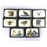 8 Doyle Yancey belt buckles, brass, assorted