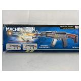 Toy machine gun with lights and sounds. In box.