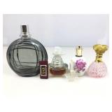 Perfume/cologne bottles. Only 2 have contents.