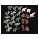 Pink and clear glass elephants and composite