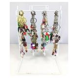 Assorted key rings on display stand.
