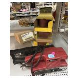 Skil sander with assorted belts.