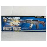Toy machine gun with lights and sounds. In box.
