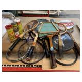 3 cans new tennis balls and Tennis rackets. Most