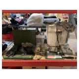 Bin of military camo tarp covers, magazine and