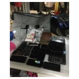 Tablets, phones, keyboard, Costco bag, and more.