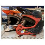 2 multi-sport helmets. Both size L