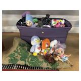 Bin of assorted toys and plush