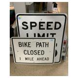 Road signs, speed limit and ï¿½Bike Path closedï¿½.
