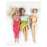 3 vintage Barbie dolls.