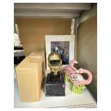 Metal football helmet on stand & more