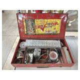 Erector build kit in metal storage box.