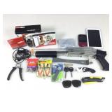 Airsoft gun, Blackberry, LG flip phone, Samsung