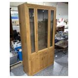 Wood curio cabinet w/glass shelves and lights up,