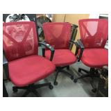 3-Rolling red office chairs