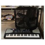 Techno Beat electronic keyboard and lasko box fan