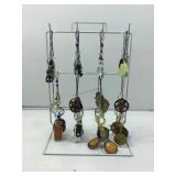 Jewelry display stand with contents. Pendants,
