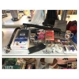 Machete in sheath, Kodak digital camera, friends