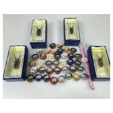 New costume jewelry rings, bug paperweights and