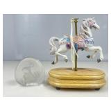 Crystal paperweight and musical carousel horse on
