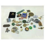 Collection of pins, keychains and more.