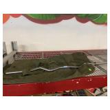 Curved weight bar and green military duffle bag