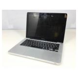 MacBook Pro laptop powers on. Password locked.