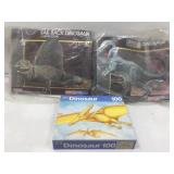 Bagged dinosaur model build kits and puzzle.