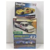 3 assorted 1:25 and 1:32 scale model build kits.