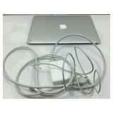 Apple laptop and charger. Powers on. Half screen