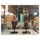 Handcarved wooden African style decorative masks.