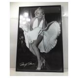 This framed print features the iconic scene of