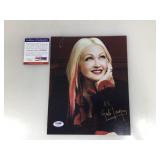 An autographed picture of Cindy Lauper certified