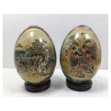 2 Asian style painted eggs w/wooden stands, 9 in