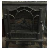 Metal electric fireplace, approx 20x9x24in