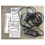 Plastic bag full of Sharp wires and remotes for a