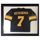 A framed under glass number seven football jersey