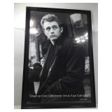 This framed black-and-white print features an